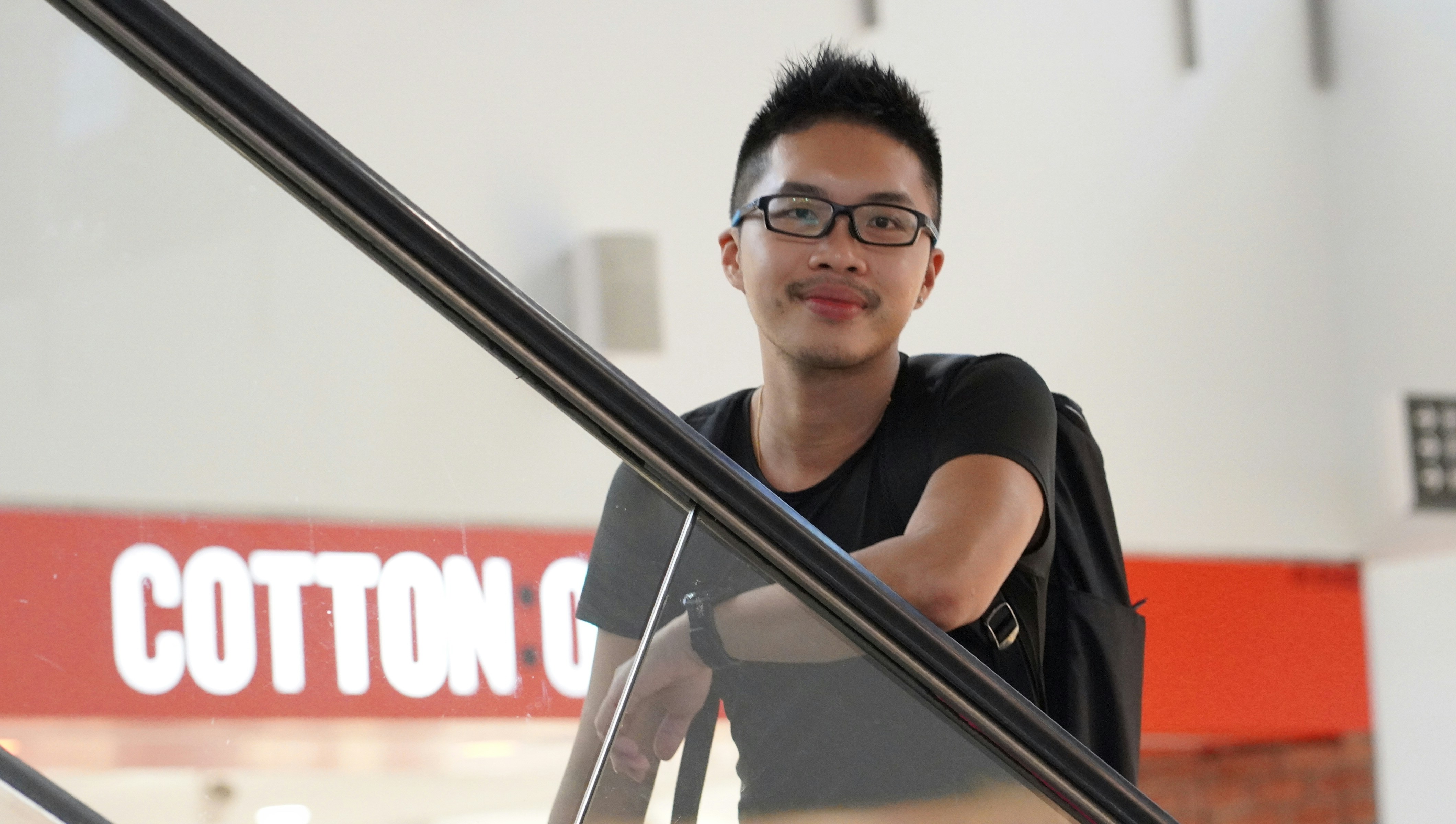 An asian guy smiling to you