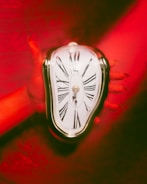 The signature soft clocks motif from Dalí's intrauterine birth painting.