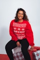 woman in red sweatshirt and black pants