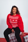 woman in red sweatshirt and black pants