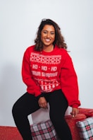 woman in red sweatshirt and black pants