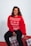 woman in red sweatshirt and black pants