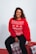 woman in red sweatshirt and black pants