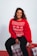 woman in red sweatshirt and black pants