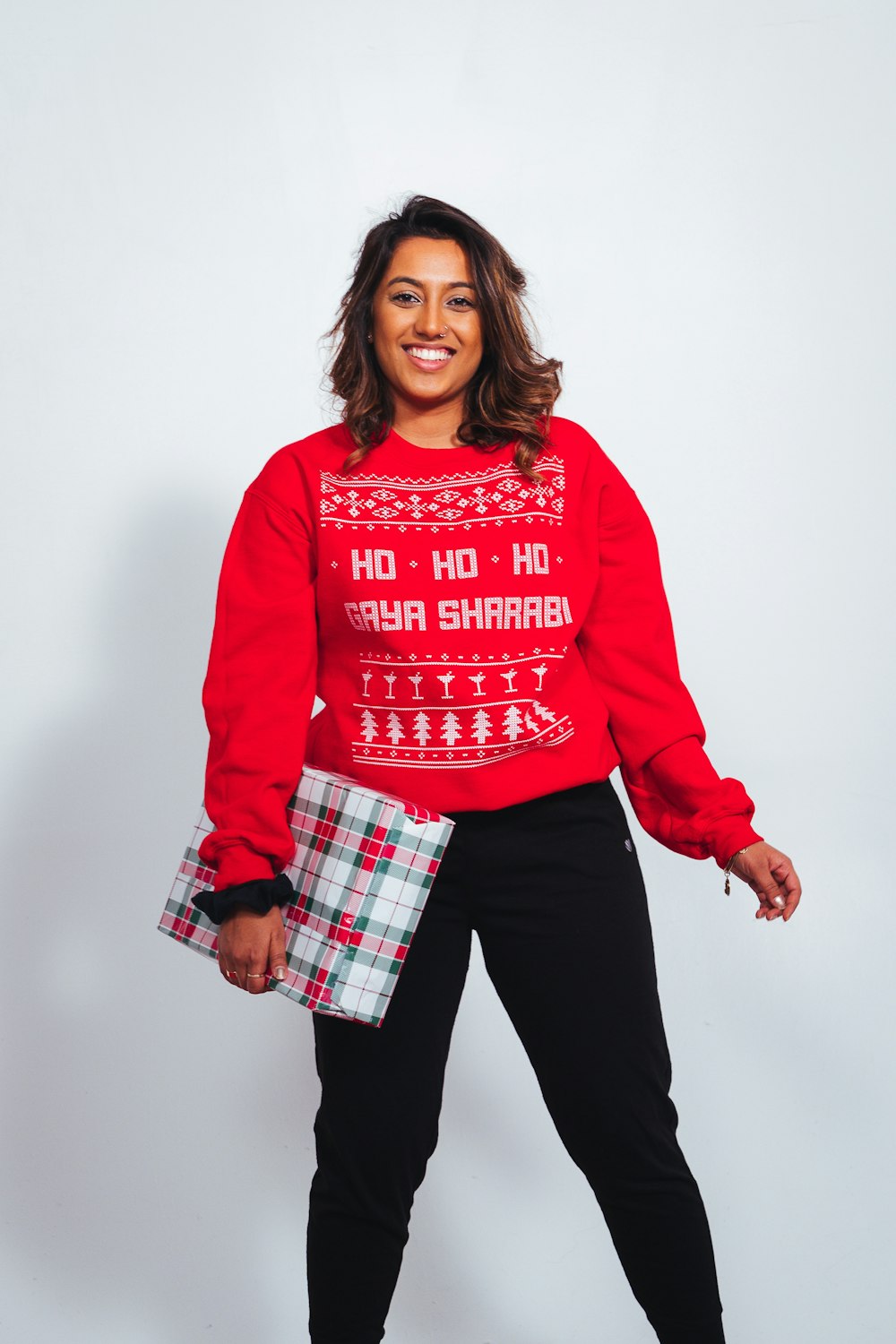 Smiling woman wearing red sweater and black pants photo – Free Sweater  Image on Unsplash