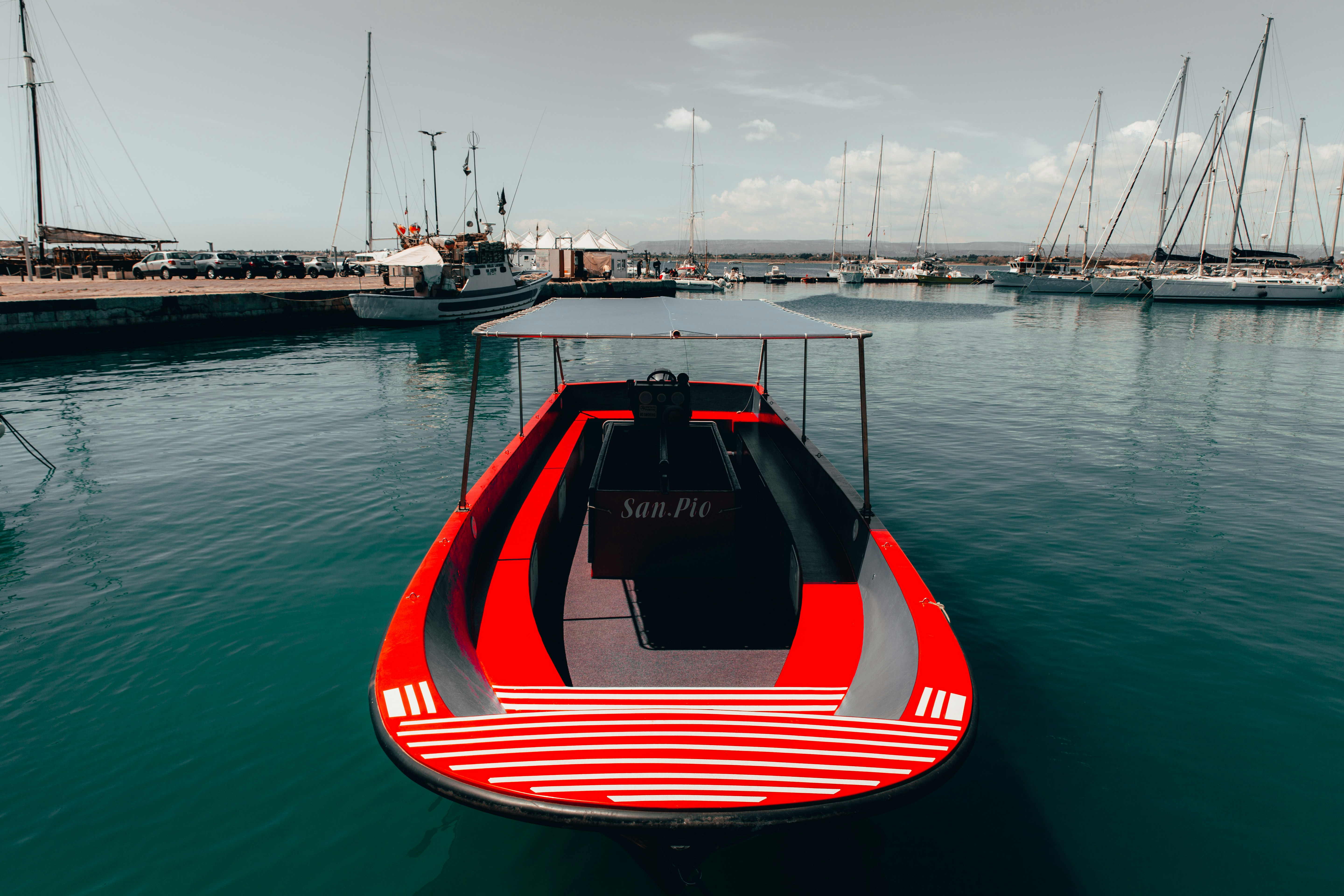 red boat on body of water