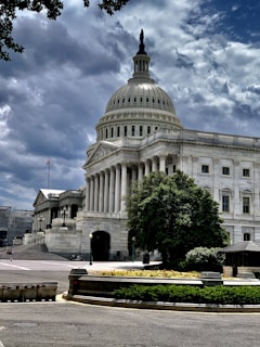 Capitol Hill during daytime under blue and white skies