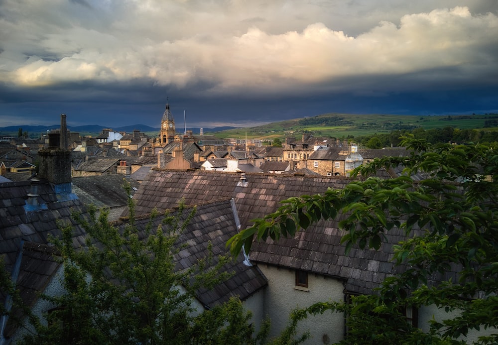 city under white clouds during daytime