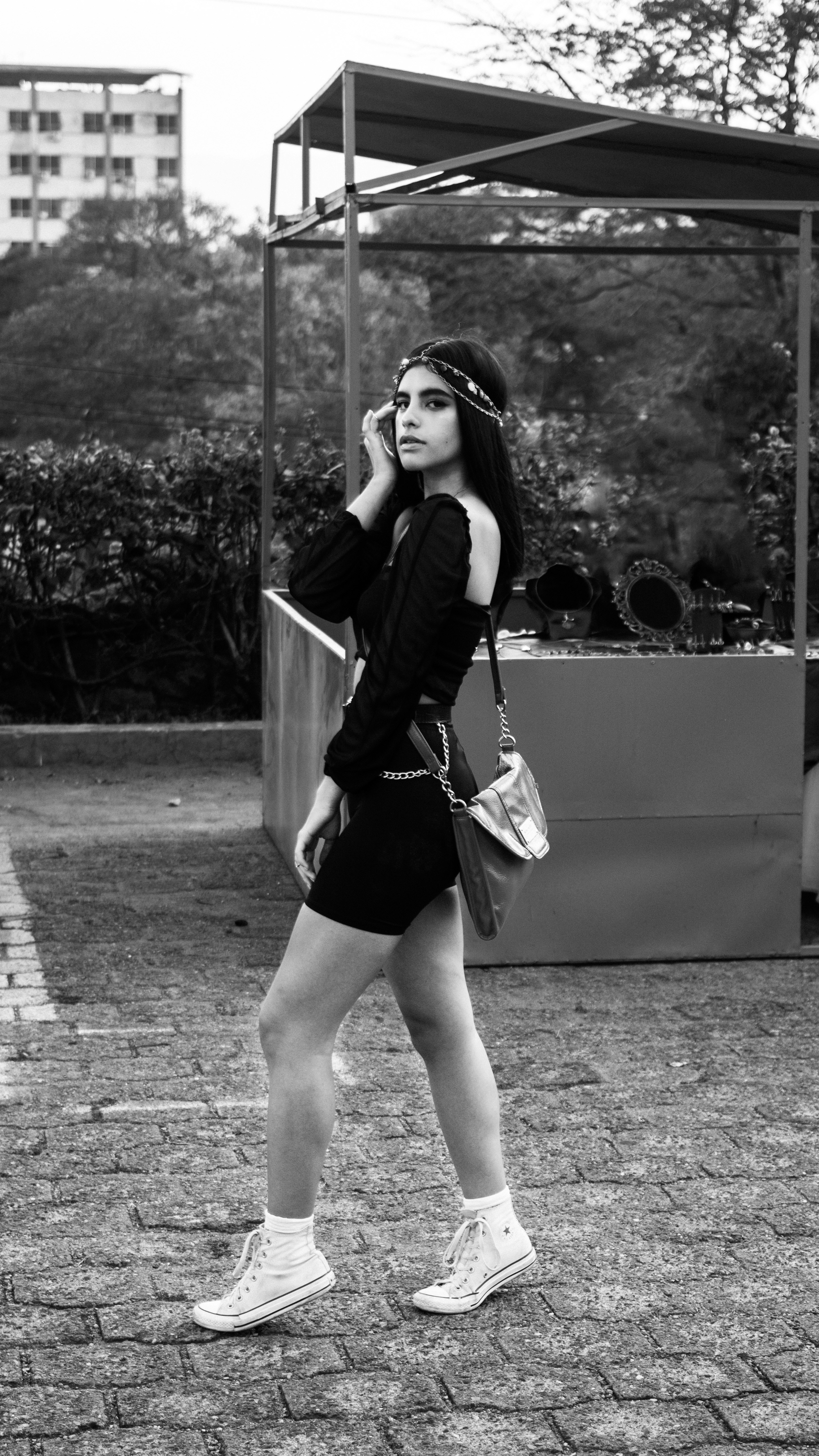 grayscale photography of girl standing outdoor
