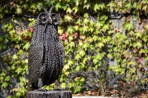 An elegant sapphire owl sculpture representing wisdom and insight.
