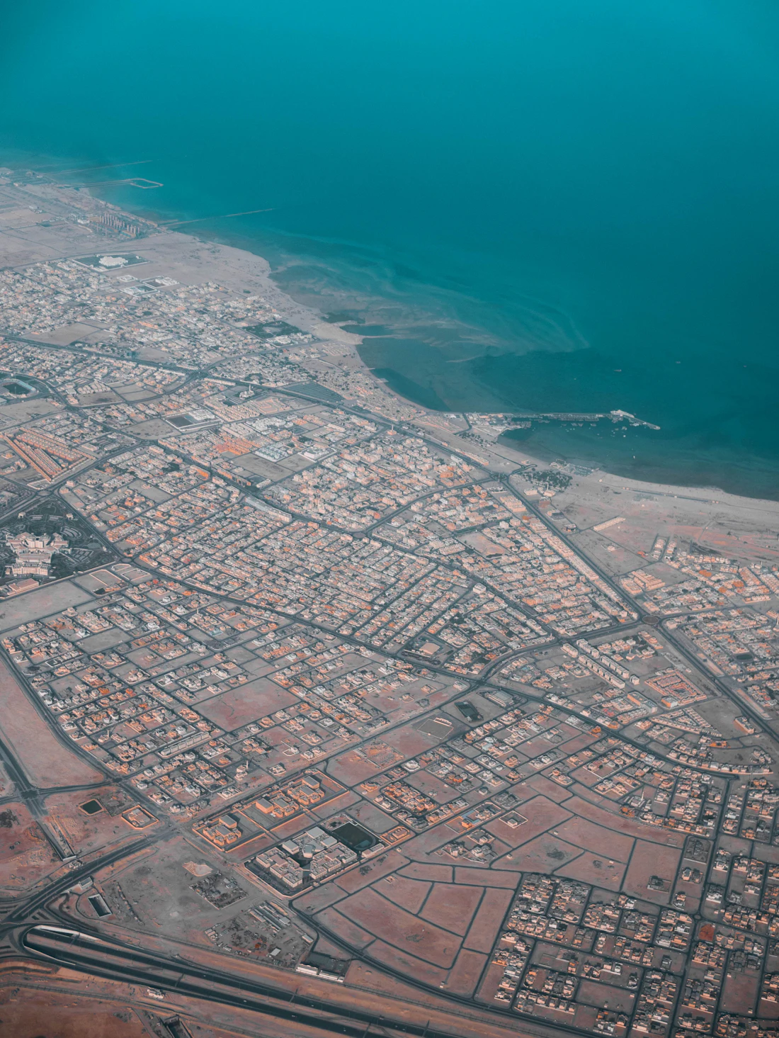 An aerial view of the city and its coastline