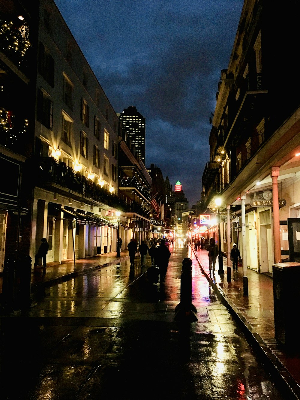 people walking on pathway between buildings