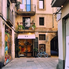 bicycle parked in front of a cafe