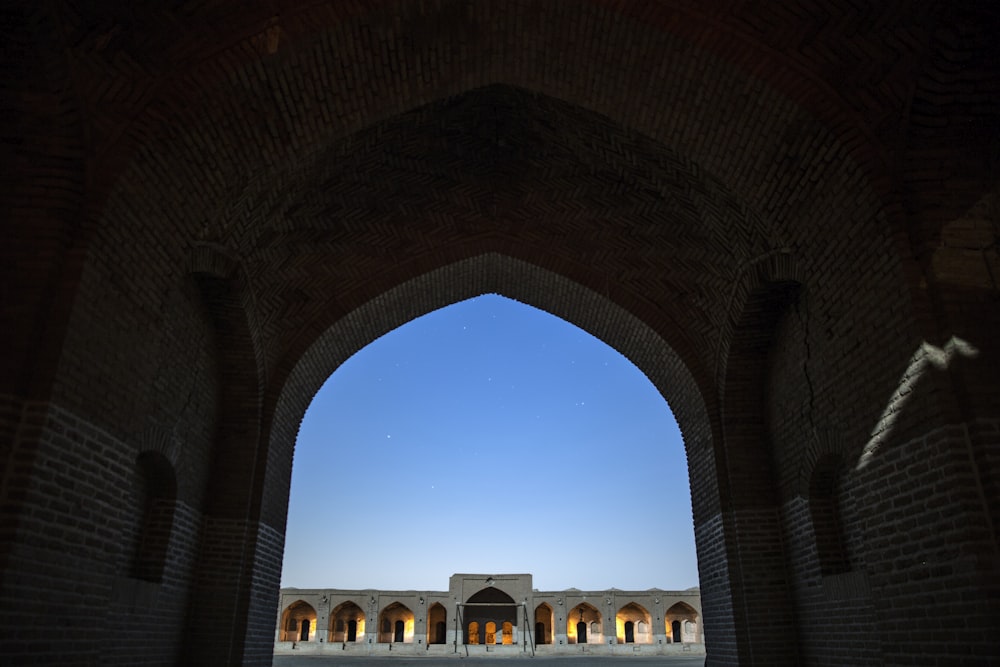 archway leading to a concrete building