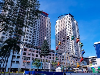 ferrris wheel beside high rise buildings