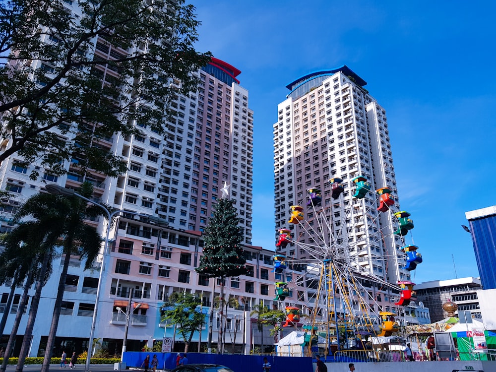 ferrris wheel beside high rise buildings