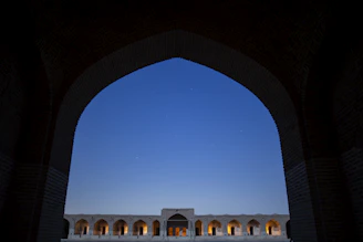 Evening view of Nivasara’s softly lit exterior under the stars.