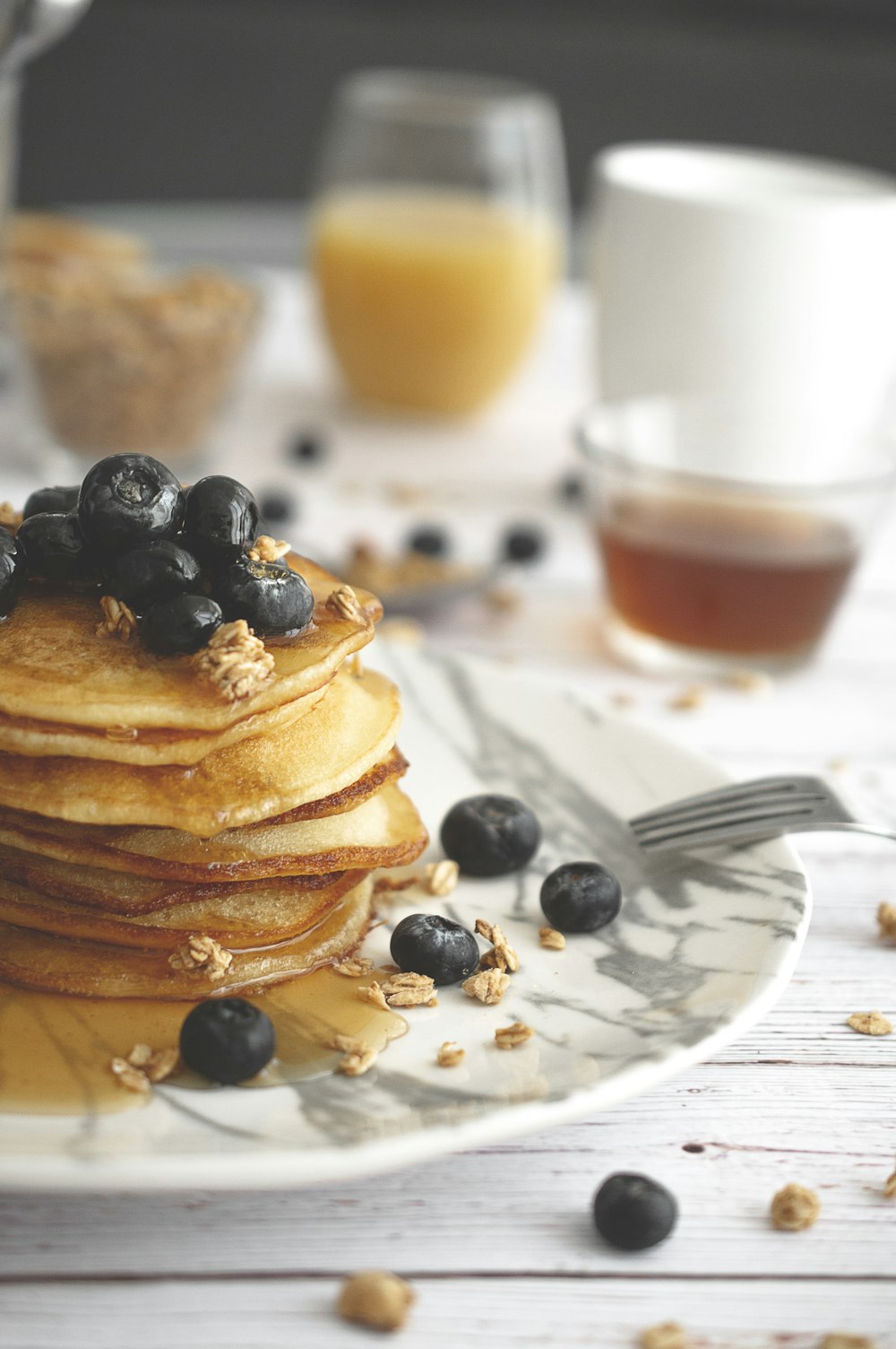 hot cakes and foods on white table