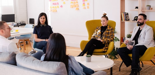 people seated on table in room by Leon (https://unsplash.com/@myleon)