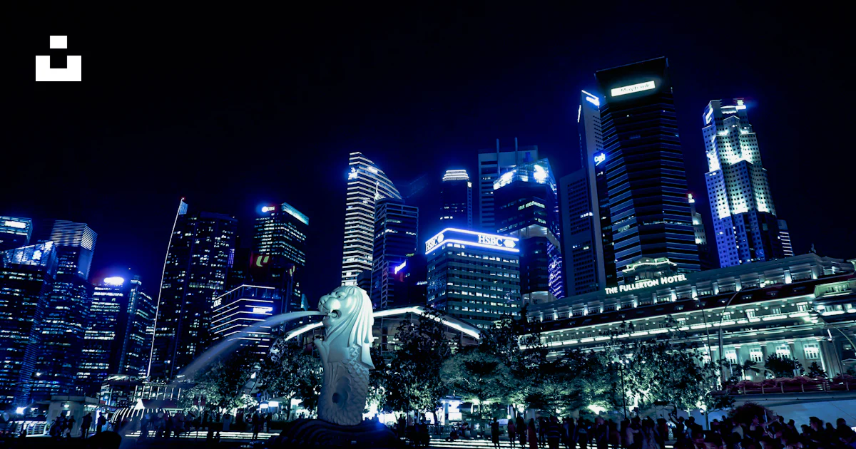 Lighted Singapore skyline with view of the Merlion statue photo – Free ...