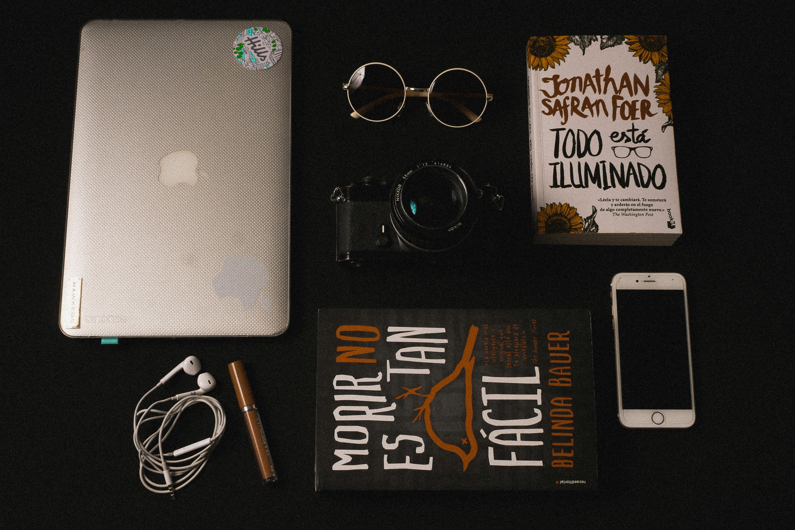 assorted Apple products on black surface