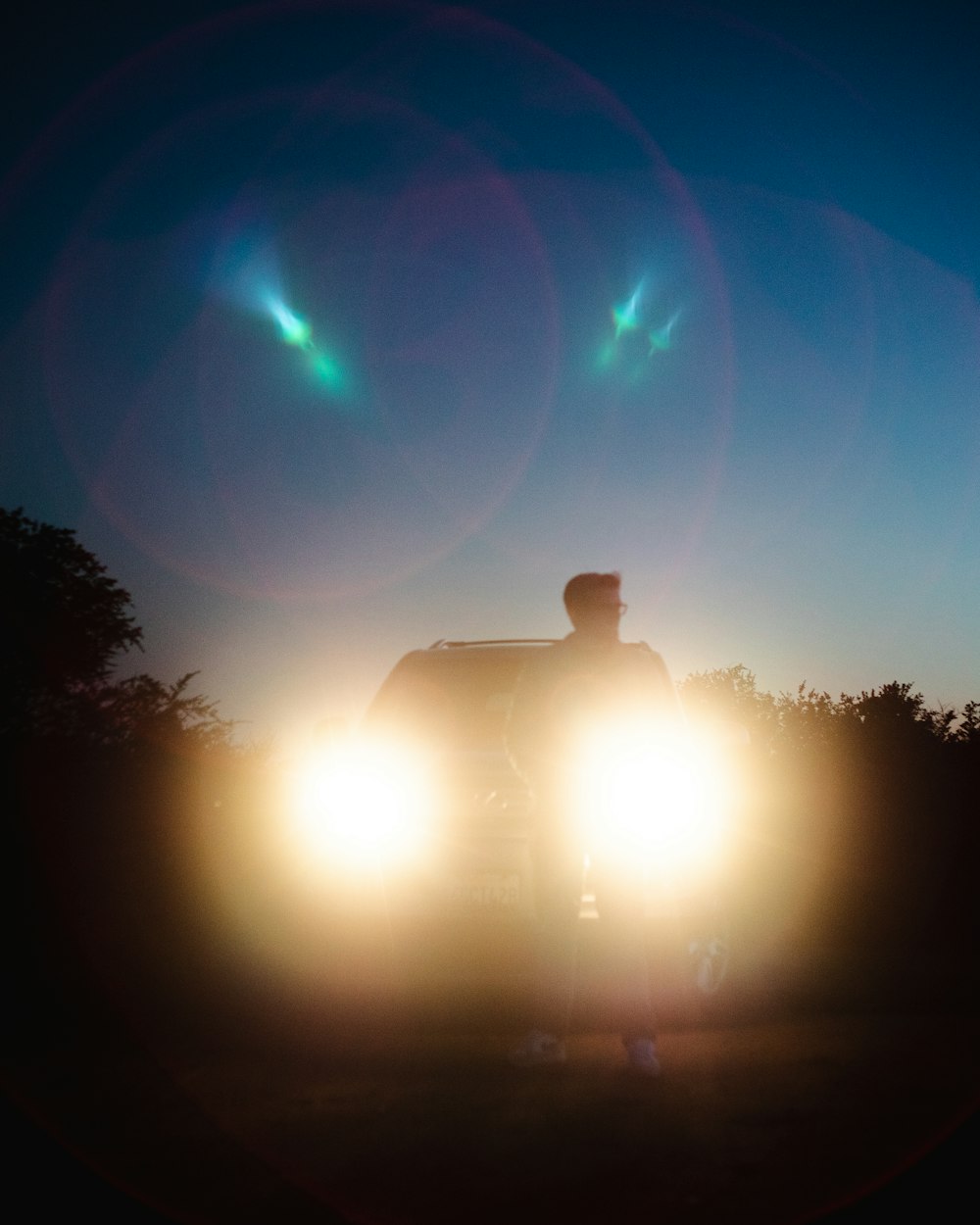 a car driving down a road at night