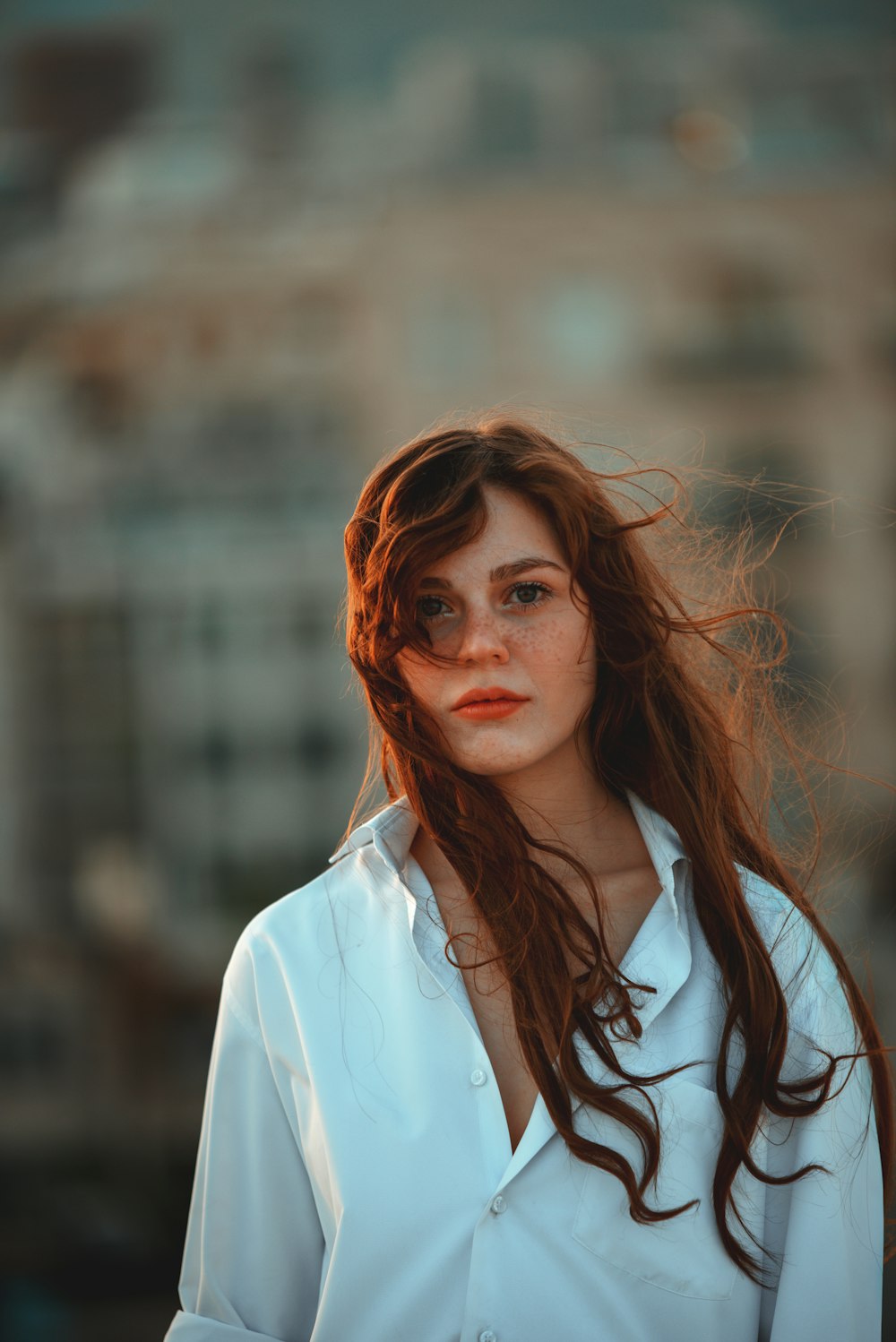brown haired woman in white dress shirt
