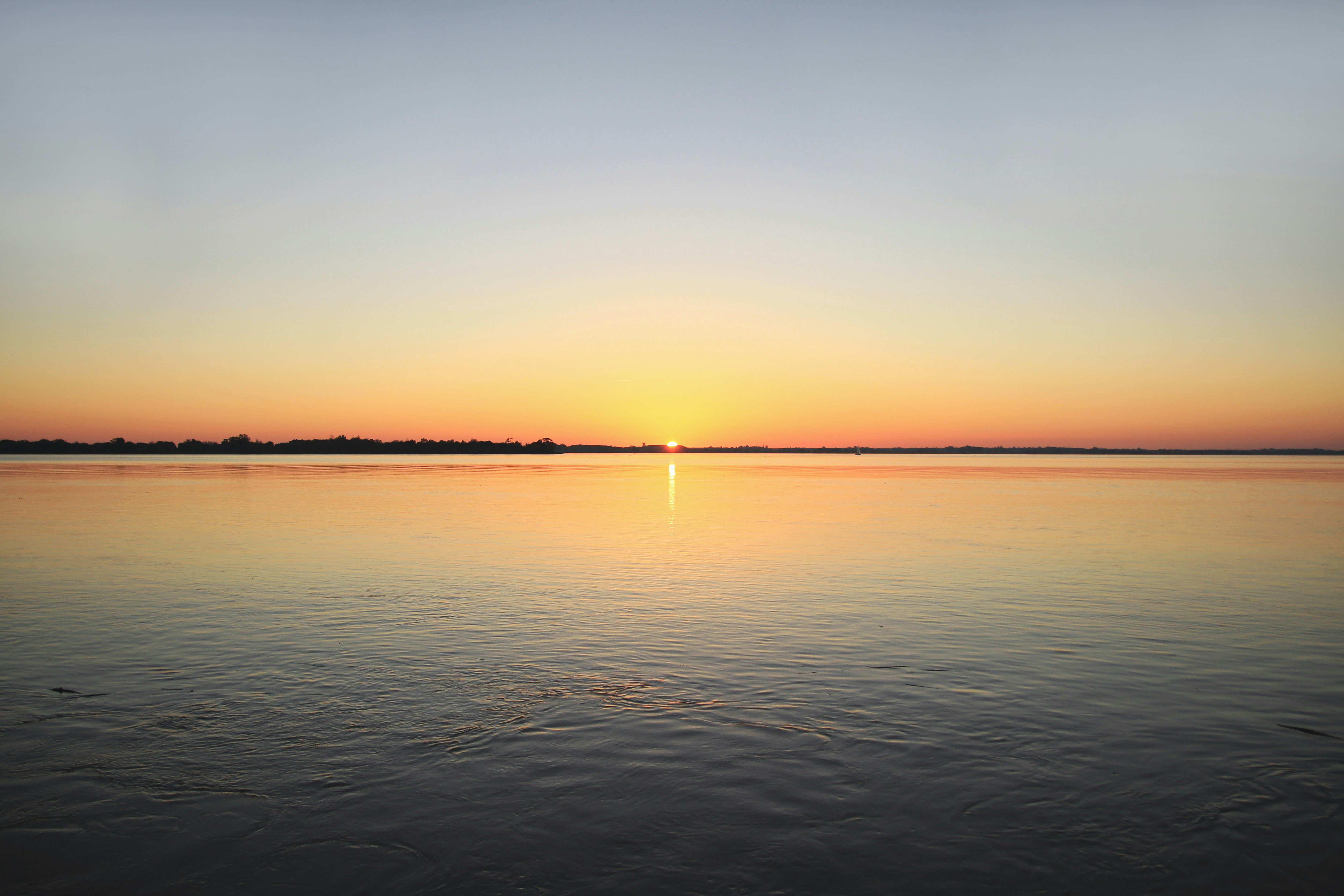 sunset on body of water