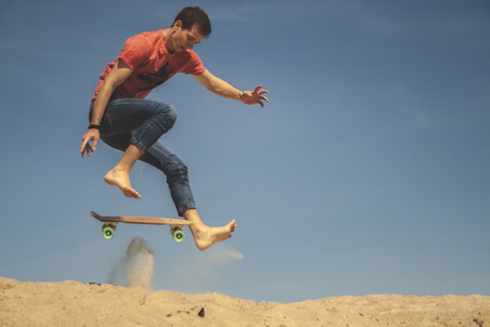 man skateboarding on desert