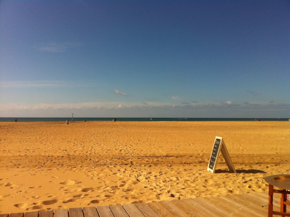 brown sand under blue sky