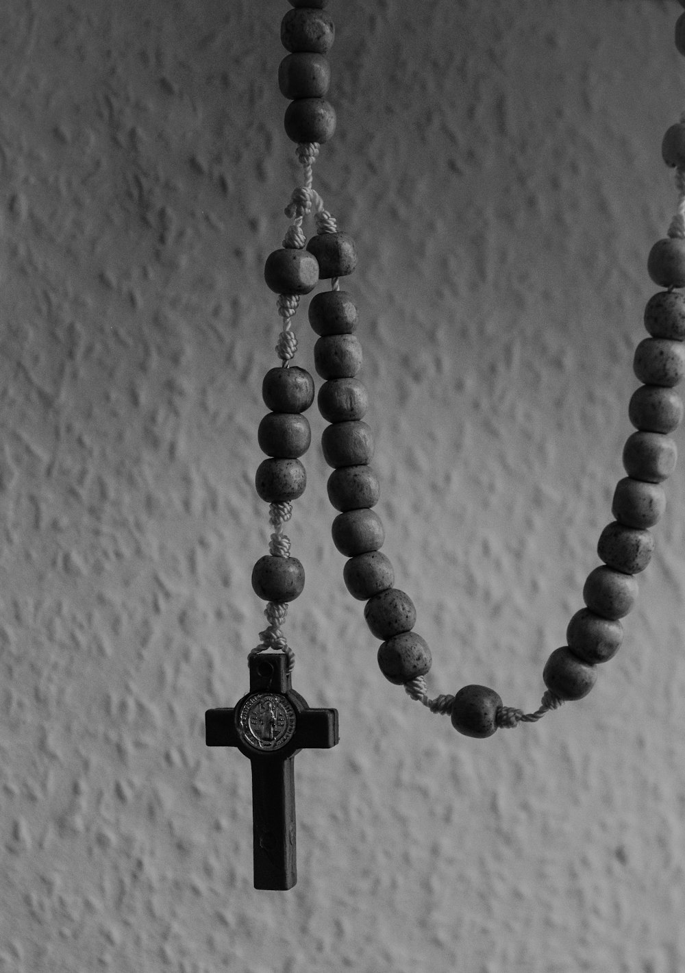 grayscale photography of rosary