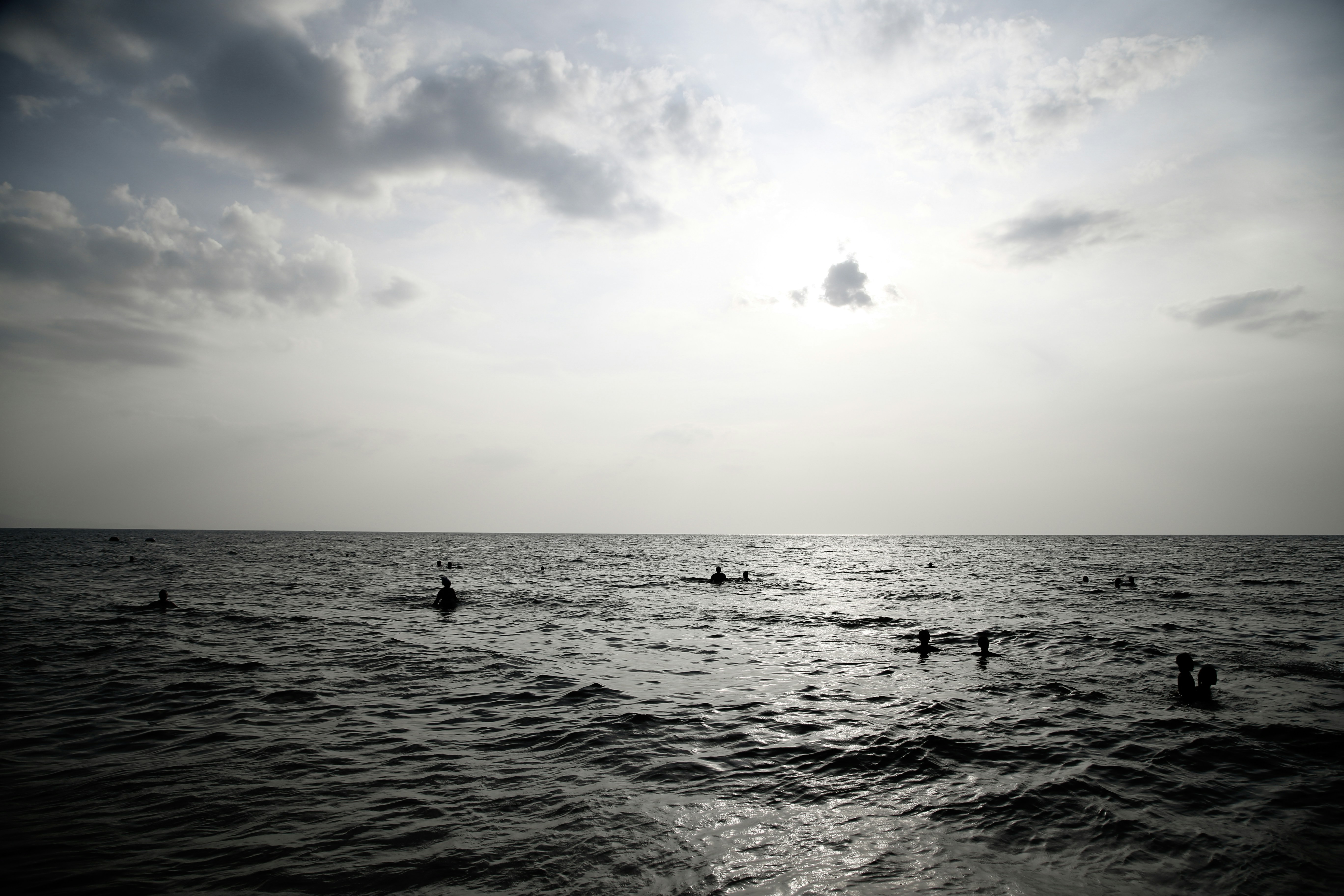 body of water under cloudy sky during daytime