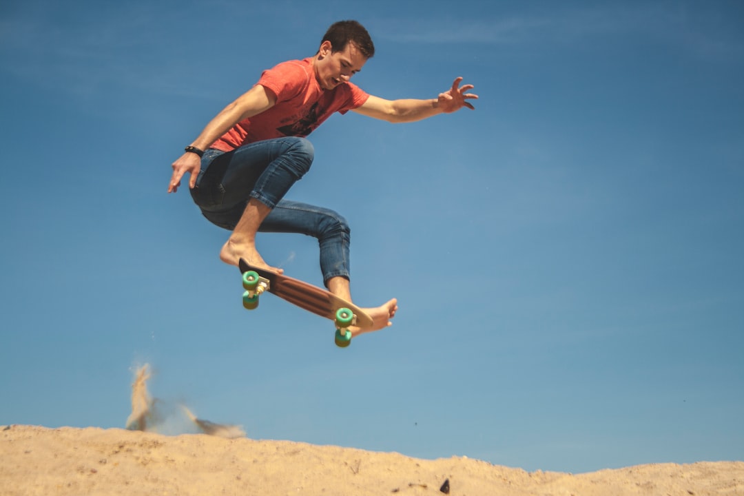 man doing tricks while riding on skateboard