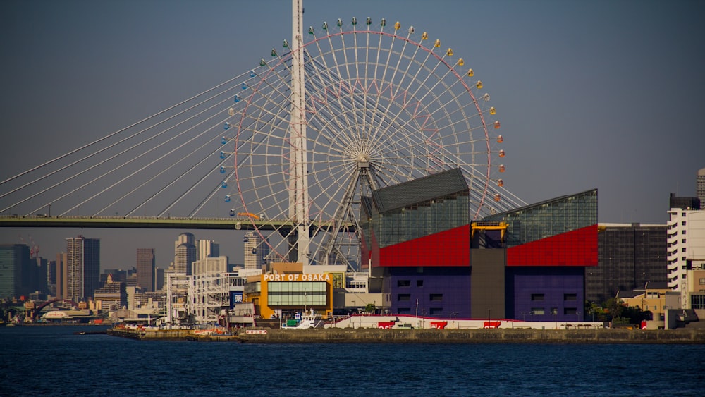 Ferris Wheel in park near bridge