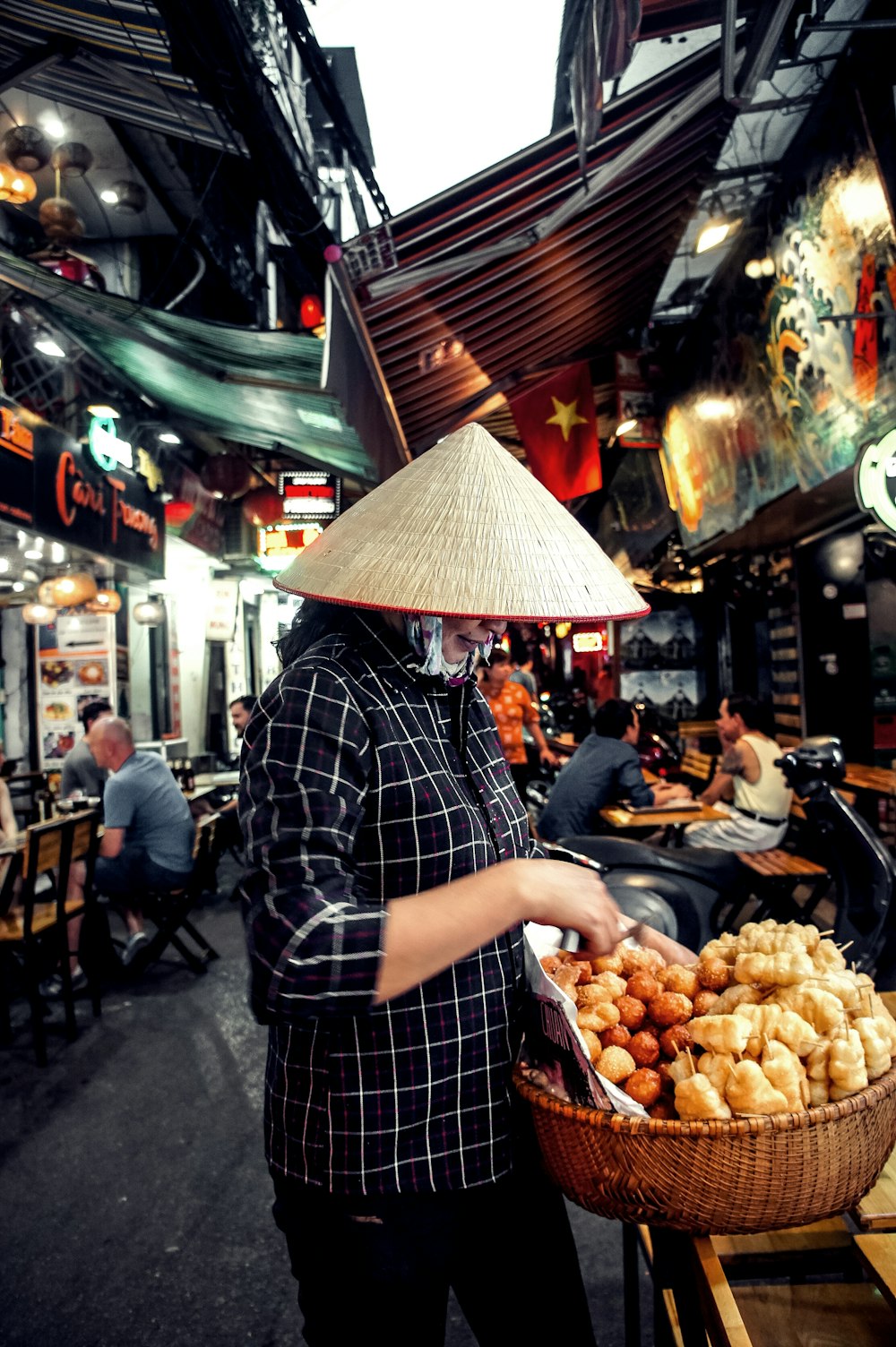 woman standing in front of basket with food inside