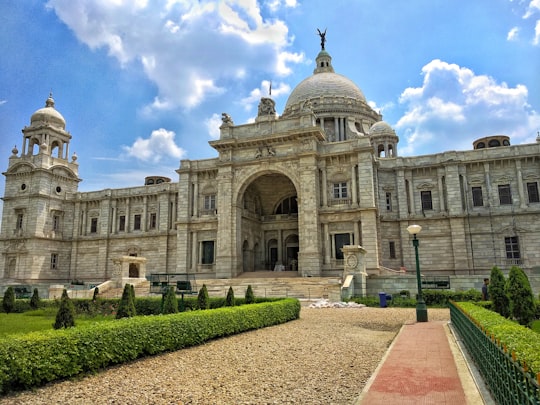 brown mansion with manicured garden in Maidan India