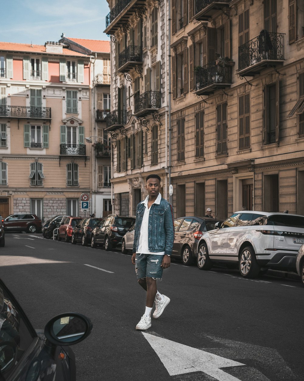 man walking asphalt road