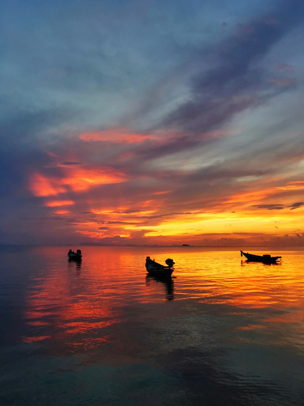 row boat under nimbus clouds