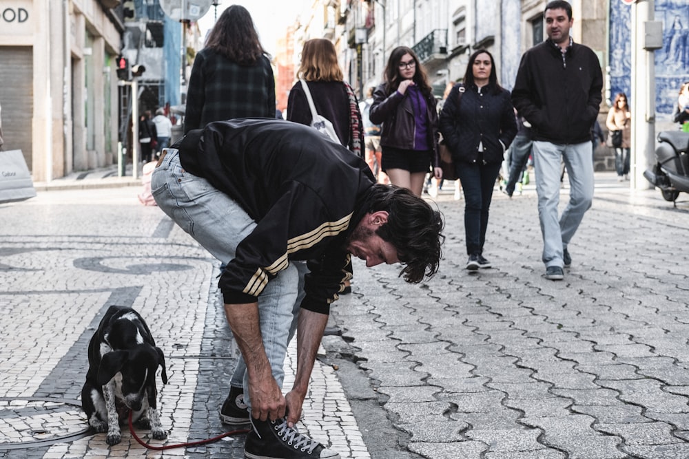 man tying his shoe lace