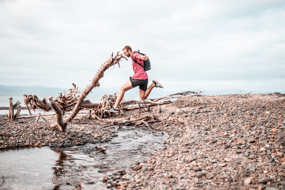 man jumping over water