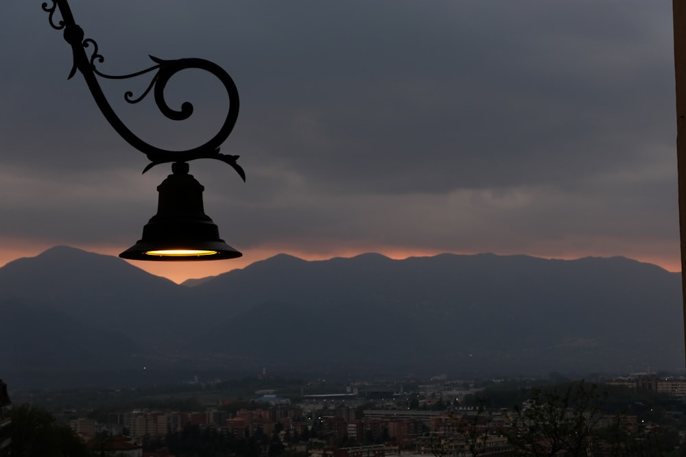 a bell hanging from the side of a building