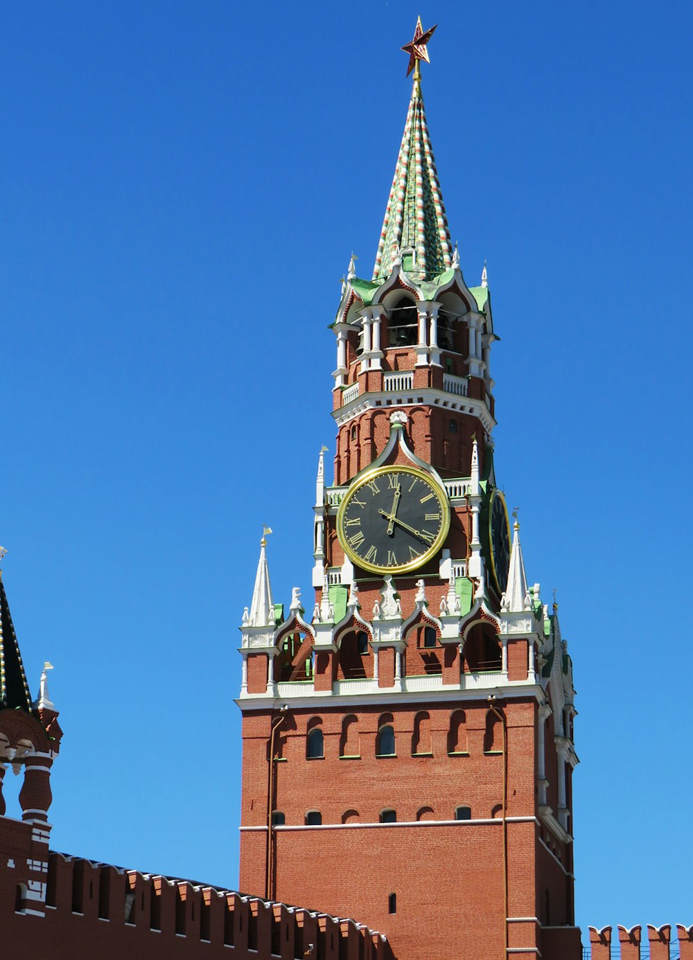 brown, green and white clock tower