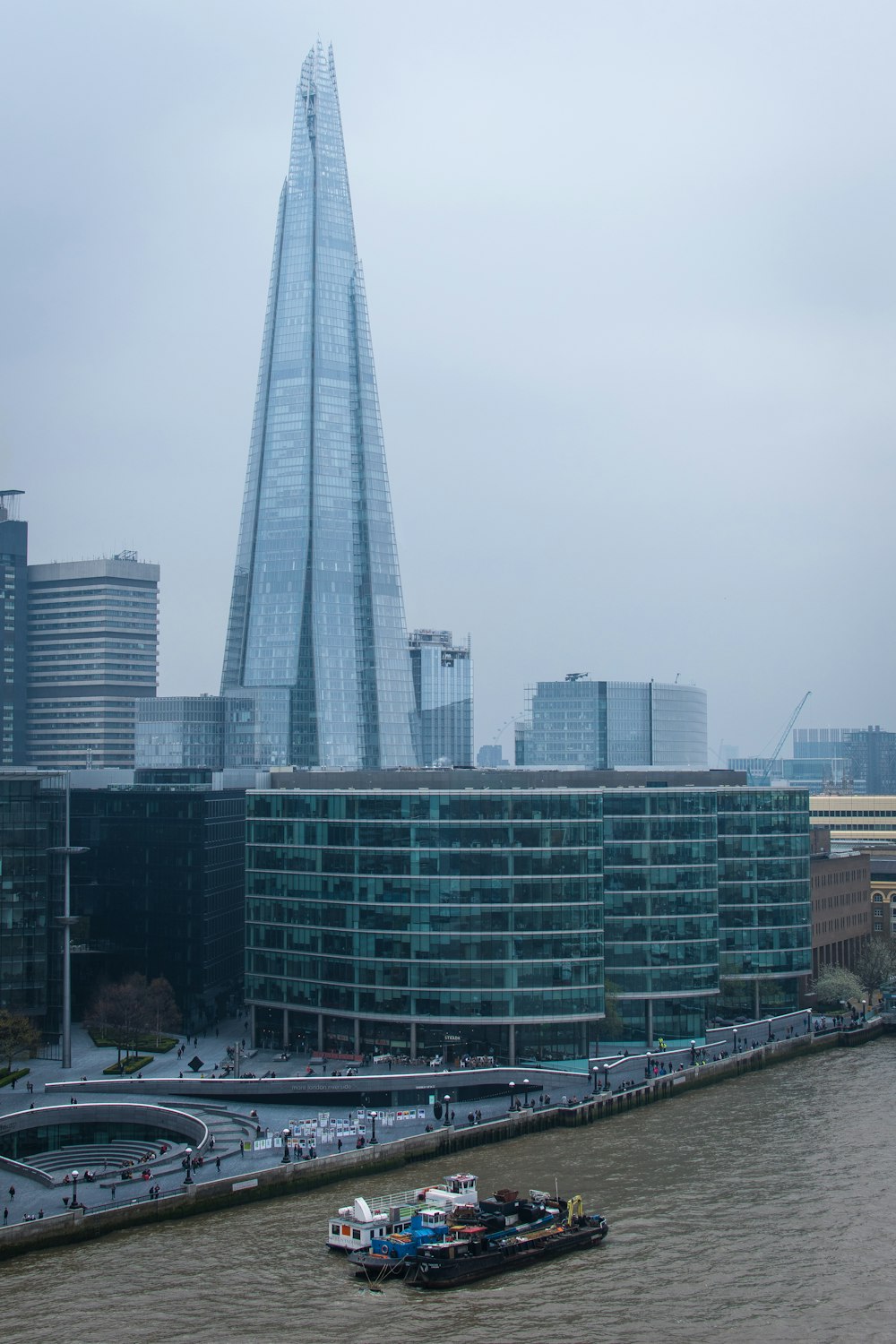 aerial photo of buildings beside sea