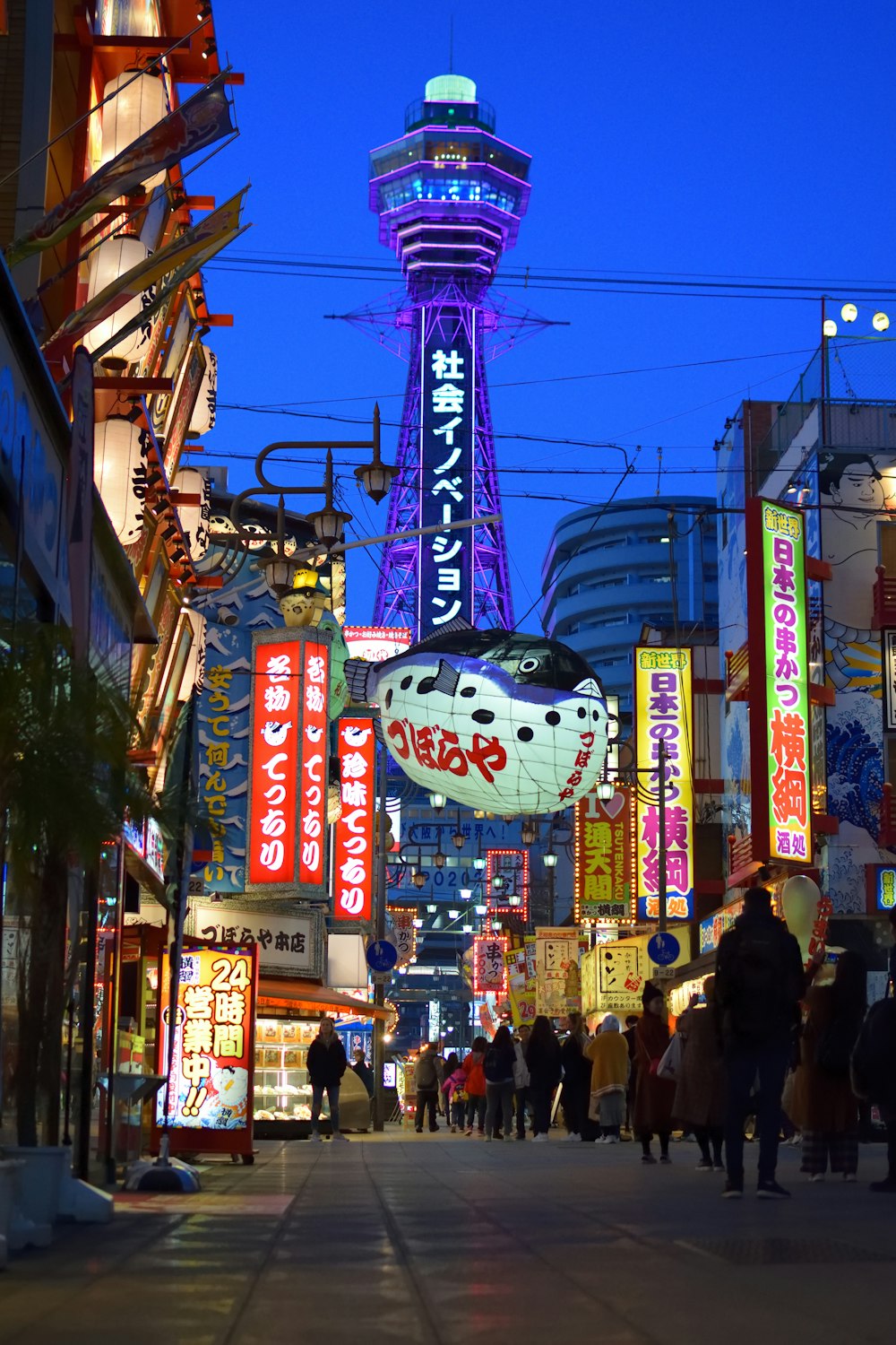 people walking on street at night