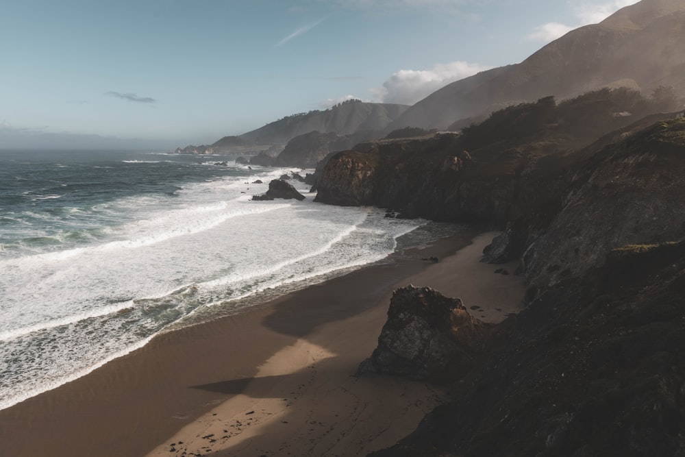 calm ocean near mountain