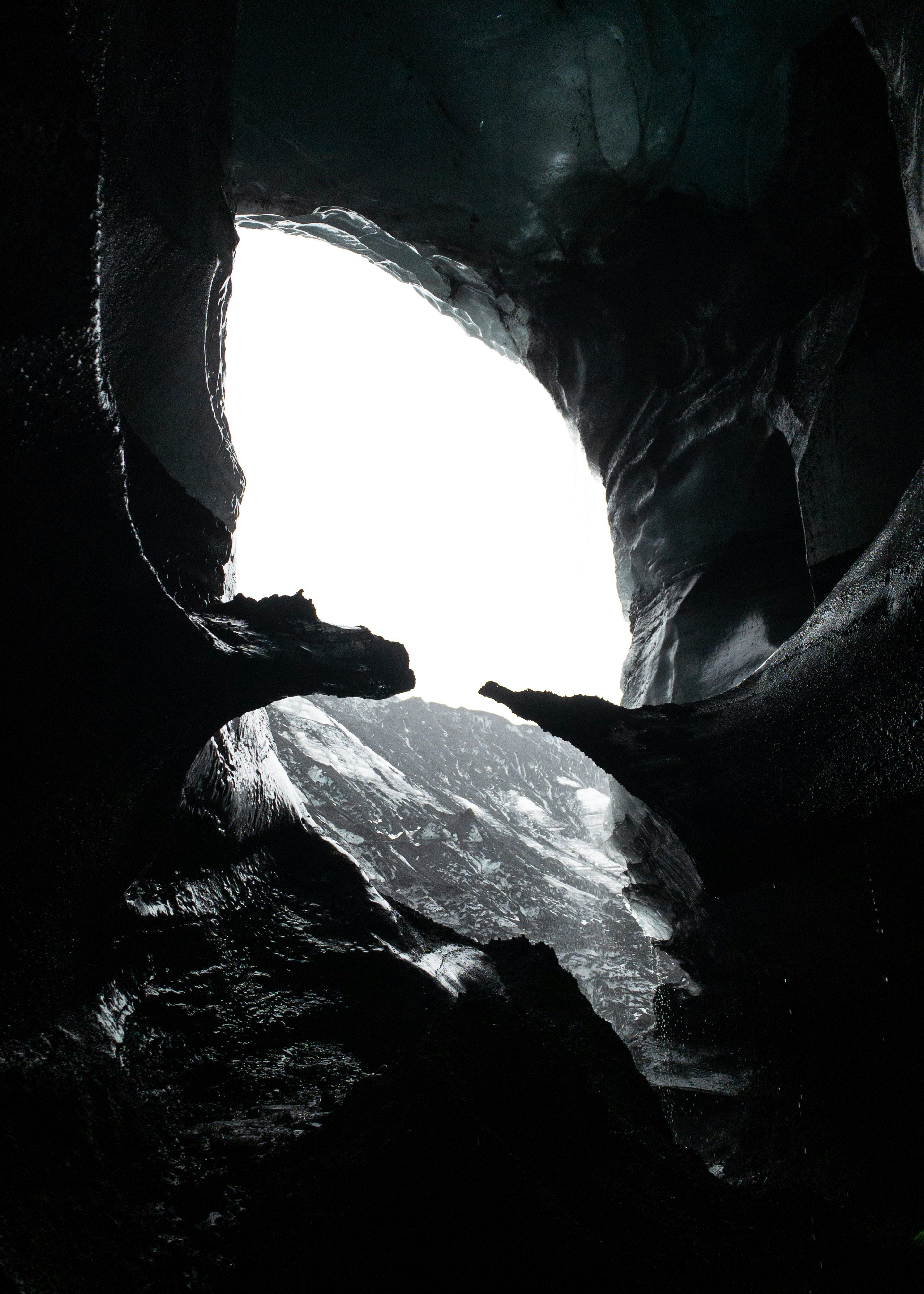 grayscale photography of cave