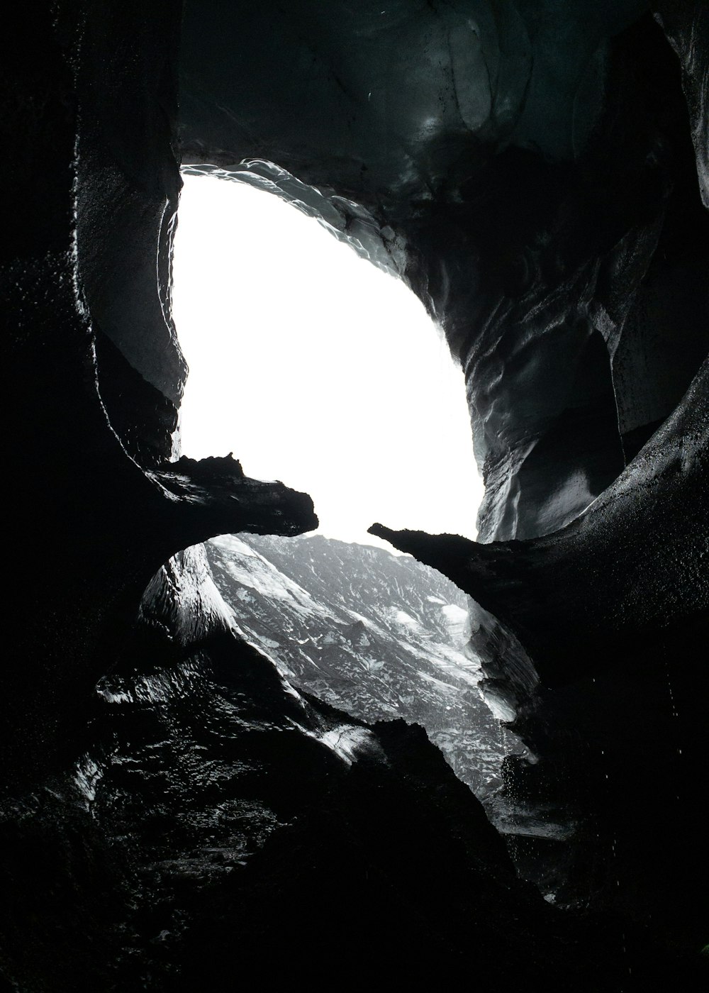 grayscale photography of cave