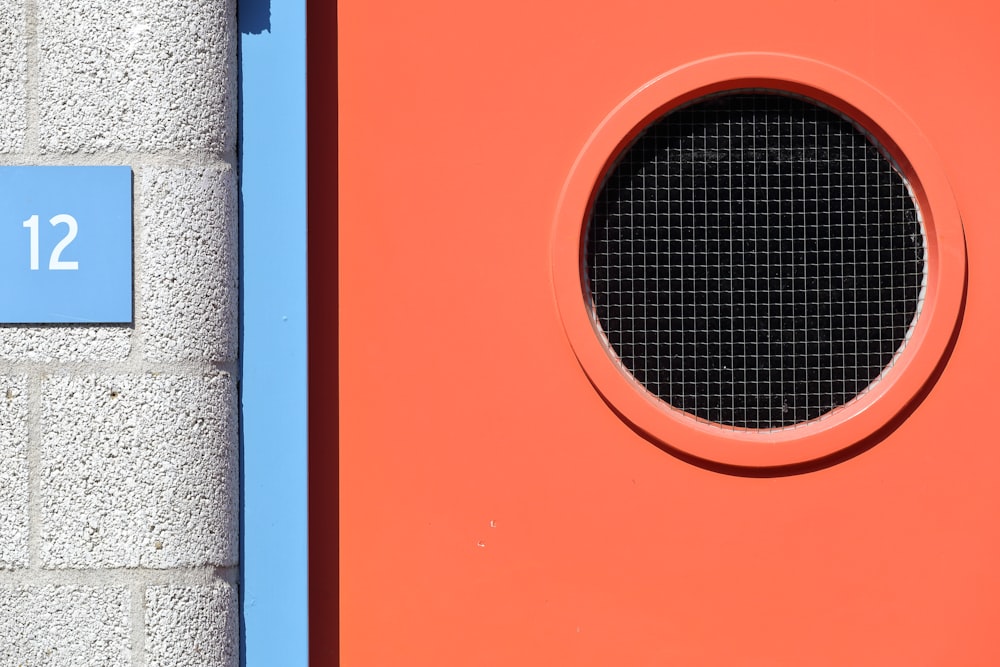 a close up of a round window on a wall