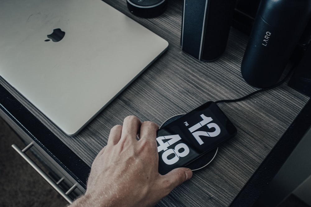 person touching black smartphone