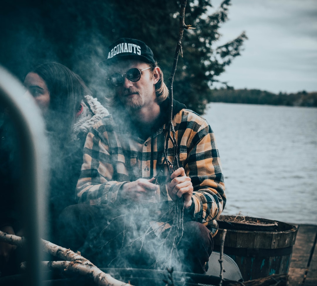 man sitting in front of smoke